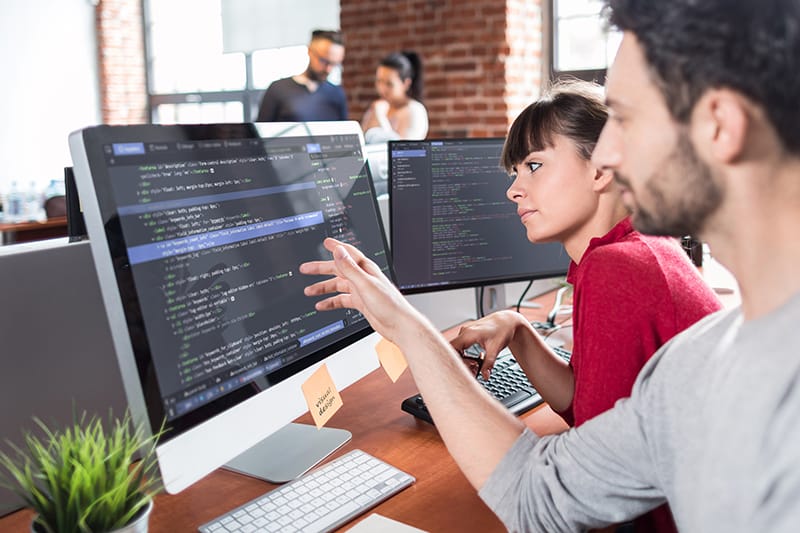 People looking at a computer